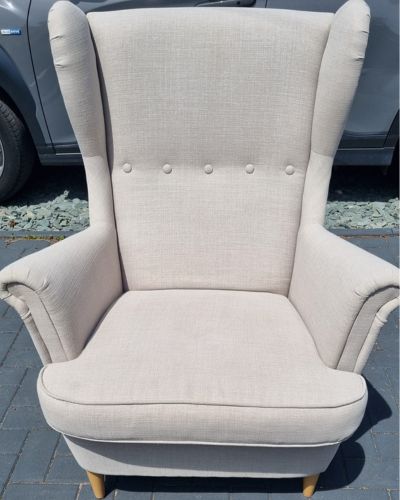 Professionally cleaned fabric armchair after upholstery cleaning
